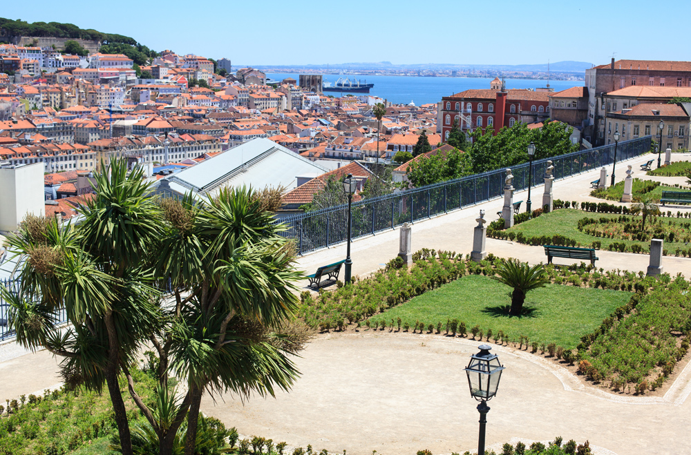 Cityscape of park and Lisbon city from Sao Pedro de Alcantara viewpoint, Lisbon, Portugal 