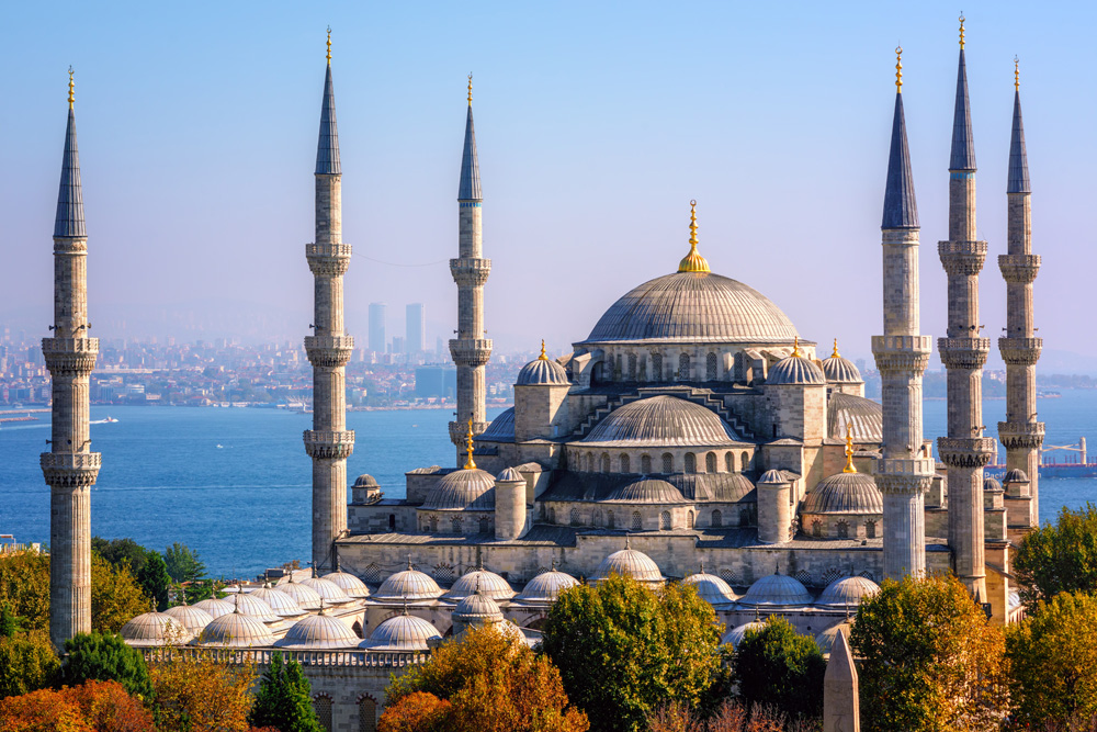 Blue Mosque (Sultanahmet Camii) with Bosphorus Sea and Asian side skyline, Istanbul, Turkey 