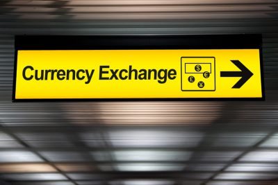 Currency exchange sign at airport