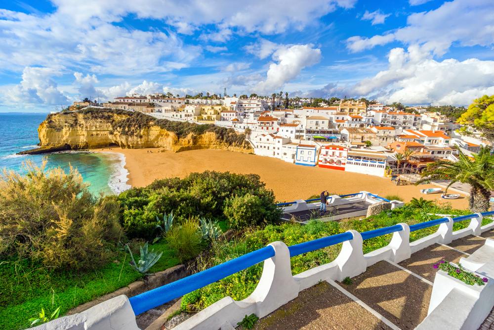 Beautiful beach, cliffs and stairs in colourful Carvoeiro, Algarve, Portugal 