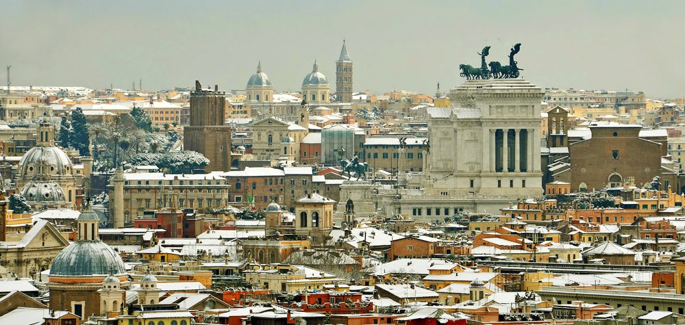 Skyline of snow covered Rome in winter, Italy 