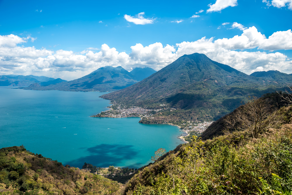 Viewpoint at Lake Atitlan with San Pedro, Atitlan and Toliman volcanos and San Pedro and San Juan villages, Guatemala 