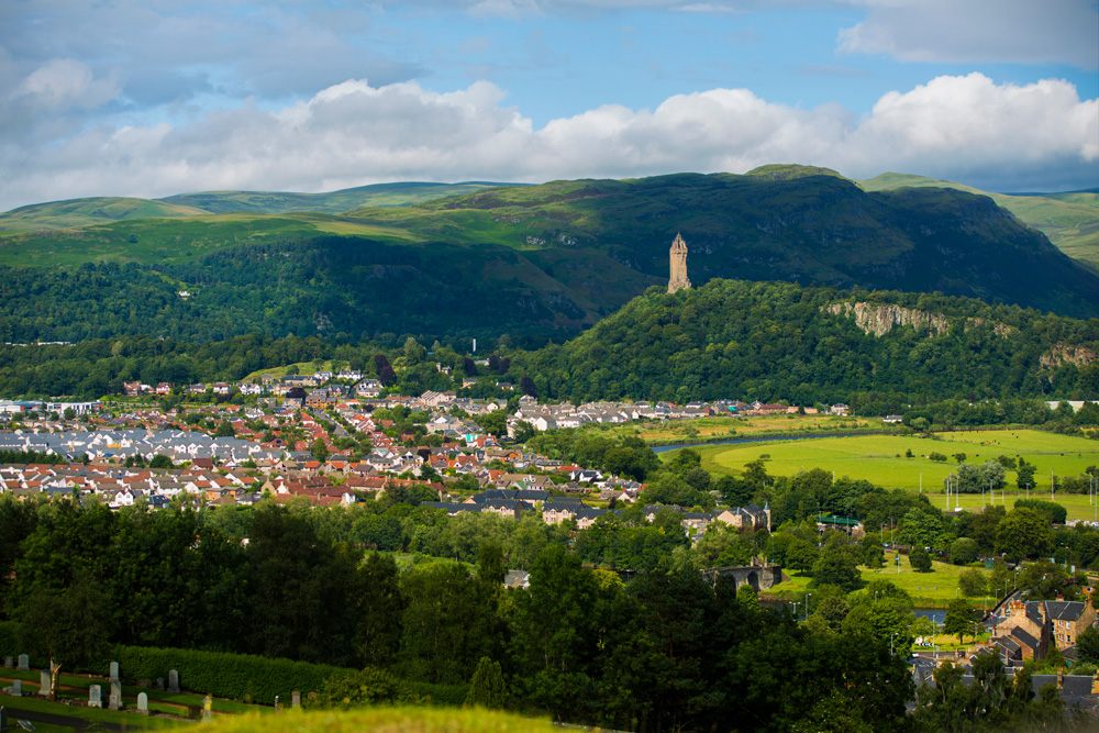 Aerial view of Stirling with the William Wallace Monument in the distance, Scotland 