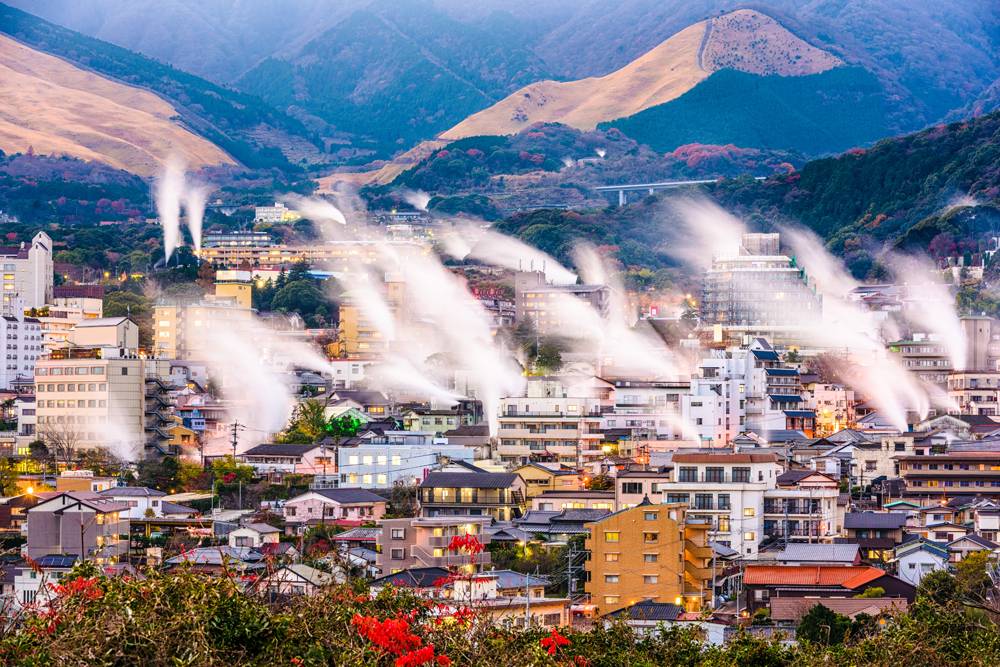 Beppu cityscape with rising steam from hot spring bathhouses, Beppu, Japan 