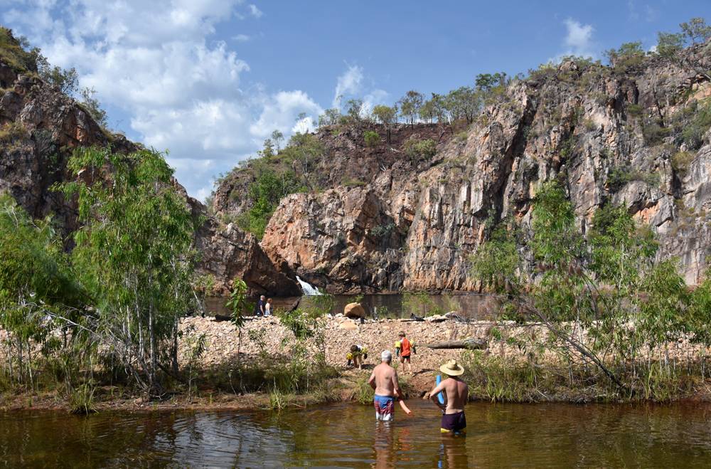 People swimming in the waterhole at Edith Falls, on the Edith River in Nitmiluk National Park, Australia 