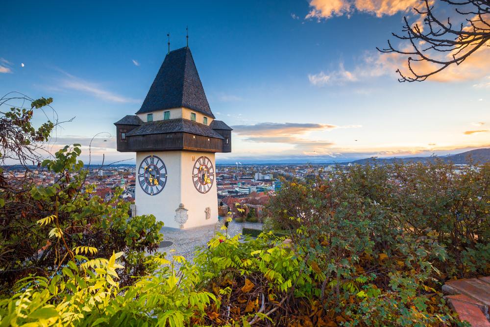 Grazer Uhrturm clock tower on a beautiful evening, Graz, Austria 
