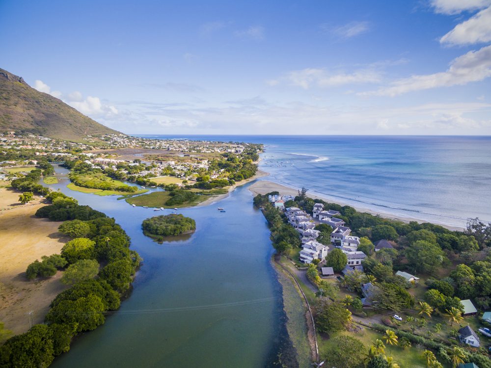 Aerial view of Black River Tamarin Beach with Black River Gorge National Park in background, Mauritius 