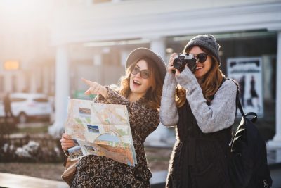 Happy female friends on travel together 