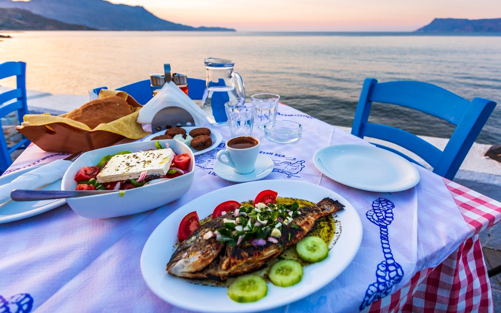 Traditional Cretan Dorada fish with Greek salad, Kissamos, Crete, Greece 
