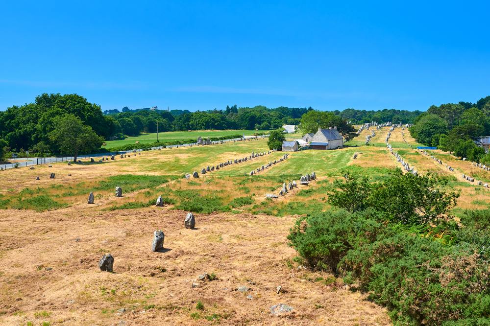 Megalithic alignment of standing stones in the Neolithic prehistoric site of Carnac, Brittany, France 