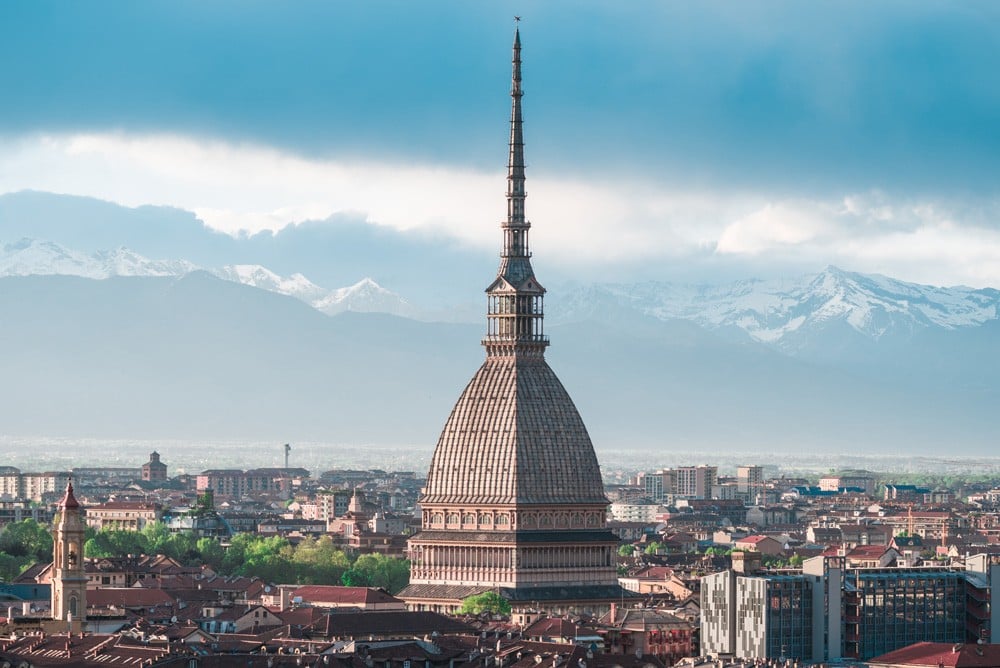 Sunset view of Turin with a close-up of Mole Antonelliana towering the city, Italy 