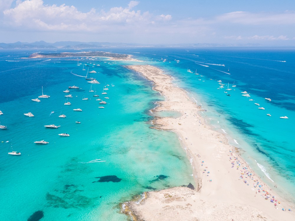 Aerial view over the clear beach and turquoise water of Formentera, Balearic Islands, Spain 