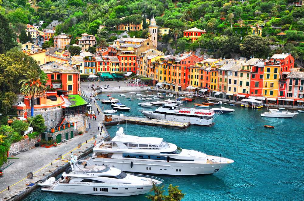 Colourful houses and villas, luxury yachts and boats in Portofino, Liguria, Italy 