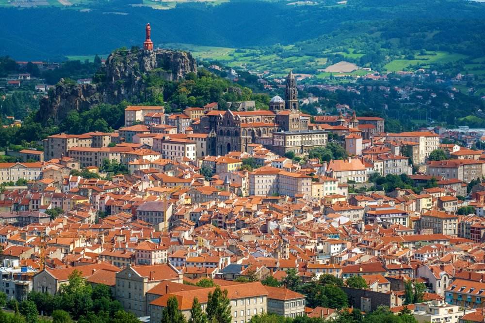 Panoramic view of red tiled roofs of Le Puy-en-Velay, Auvergne, France 