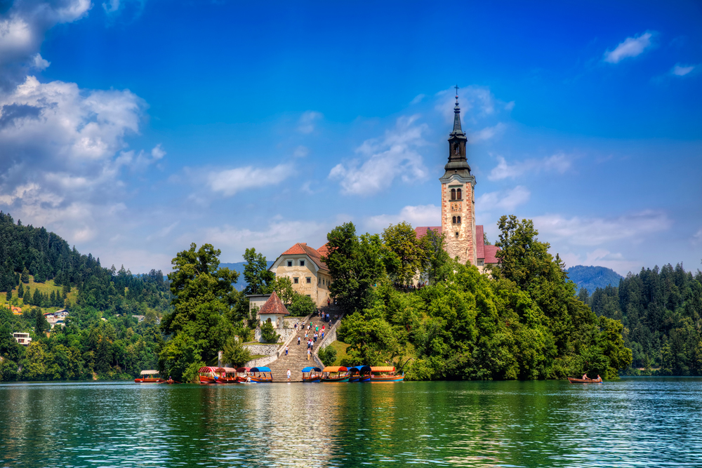 Boats moored by the steps at Bled Island in Lake Bled, Slovenia