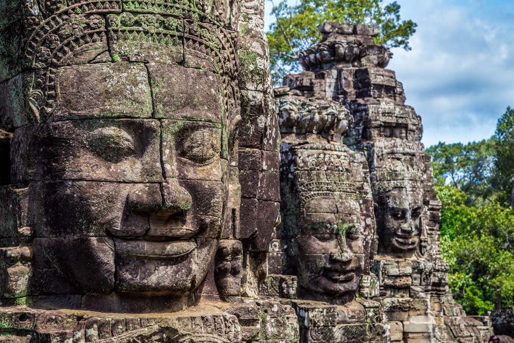Buddhist faces on towers at Bayon Temple, Angkor Wat temple complex, Siem Reap, Cambodia 