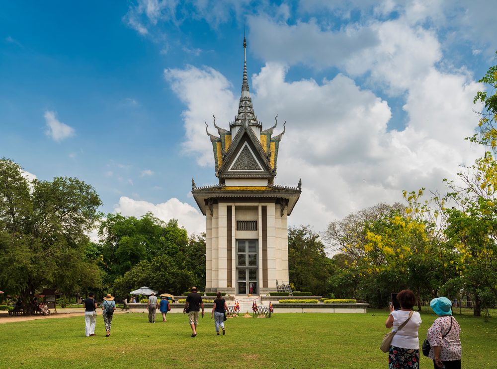 Tourists visiting the skull pagoda in the Killing Fields, Phnom Penh, Cambodia 