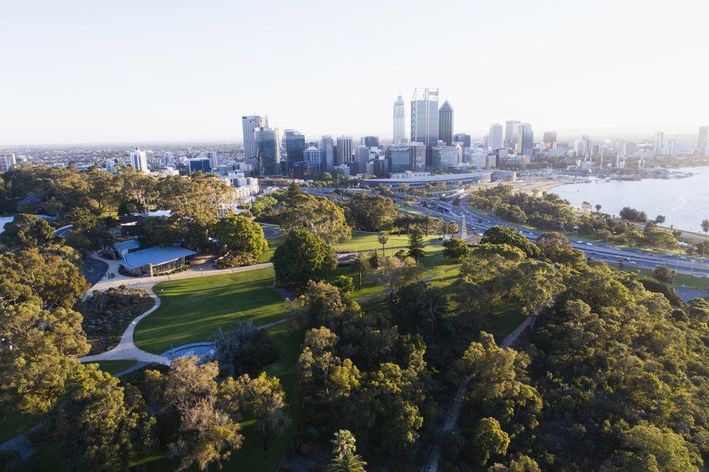 Aerial view of Kings Park and Botanical Garden with Perth City skyline in the background. Australia - Tourism Western Australia