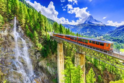 Gornergrat tourist train with waterfall, bridge and Matterhorn, Zermatt, Switzerland