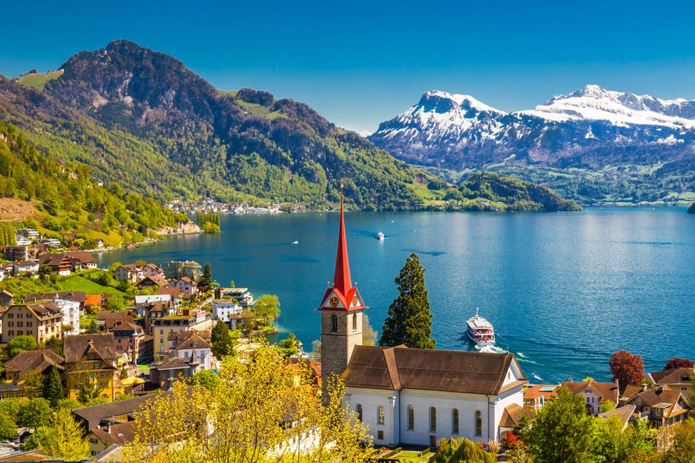Lake Lucerne in Weggis village with Pilatus mountain and Swiss Alps in background, near Lucerne, Switzerland 