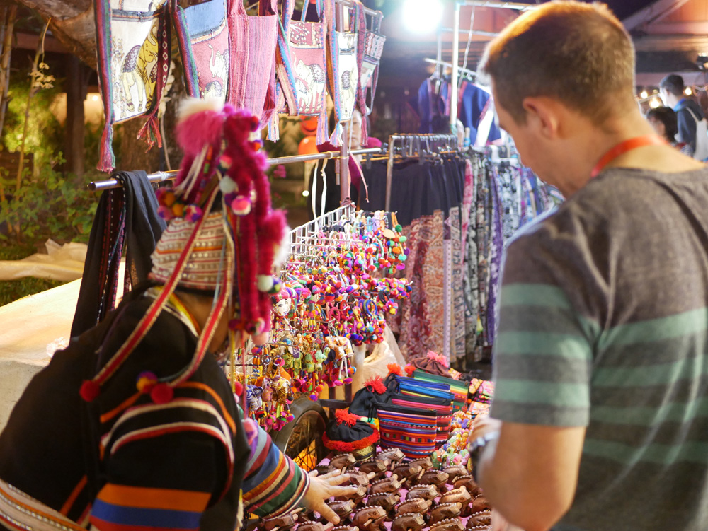 Negotiating the price of hill tribe souvenirs in Chiang Mai, Thailand 