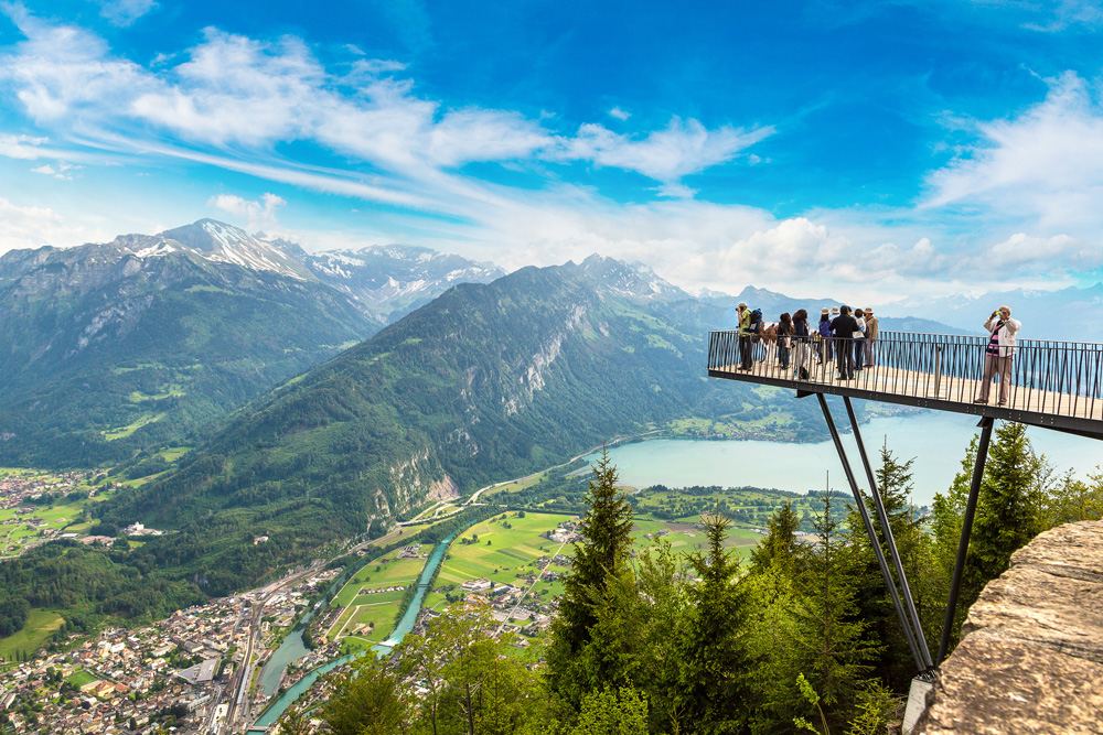 People standing on the observation deck in Interlaken on a beautiful summer day, Switzerland 