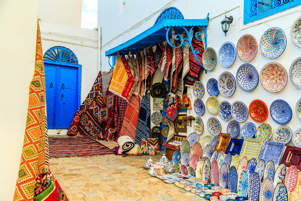 Souvenir earthenware and carpets in a Tunisian market, Sidi Bou Said, Tunisia 