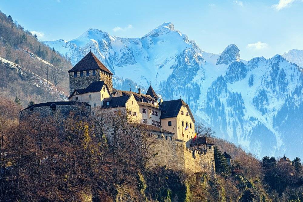 Vaduz Castle in winter, with Alps in background, Liechtenstein 