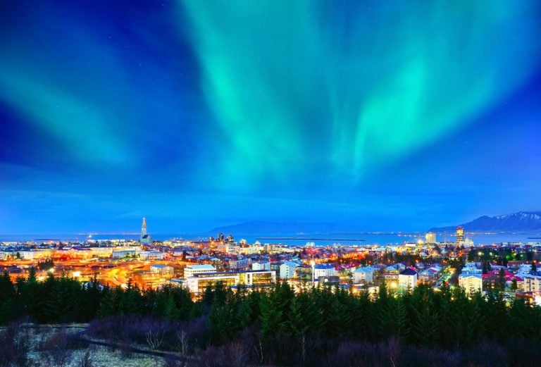 View of the Northern Lights from the city centre in Reykjavik, Iceland