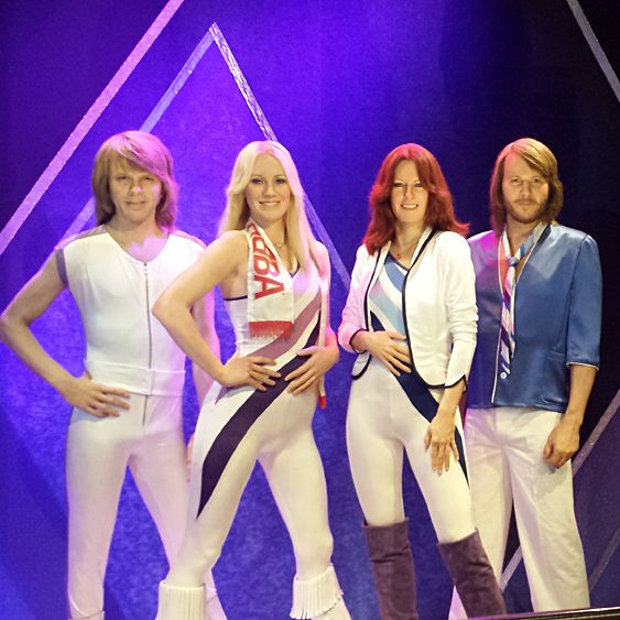 Christian Baines - Chris with wax figures of ABBA at the ABBA Museum, Stockholm, Sweden