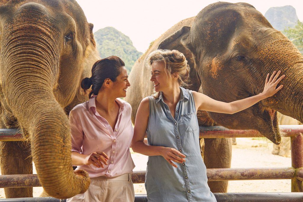 Female couple with elephants
