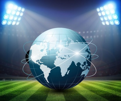 Green Soccer Field and Bright Spotlights with Globe