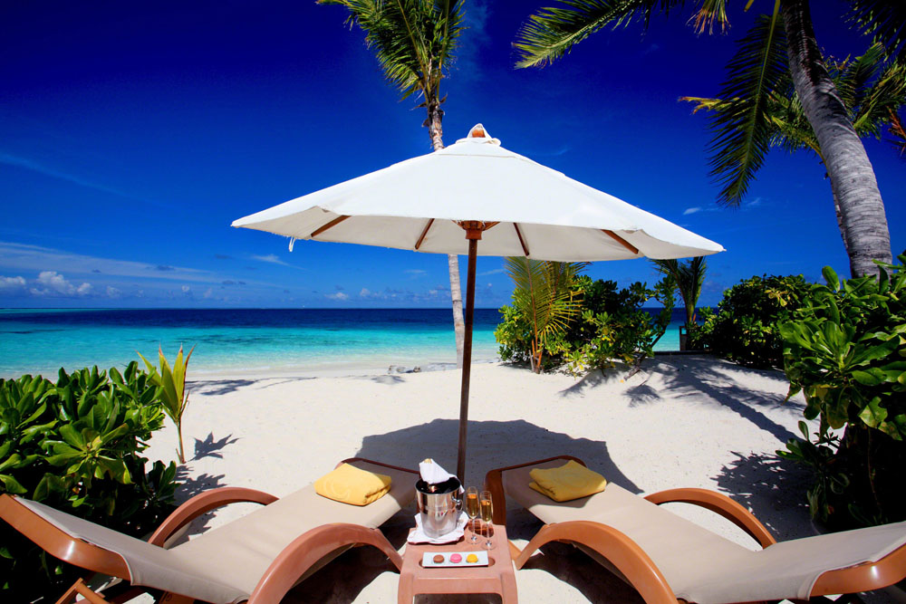 Relaxing on the beach sipping-some-bubbly at Centara Ras Fushi