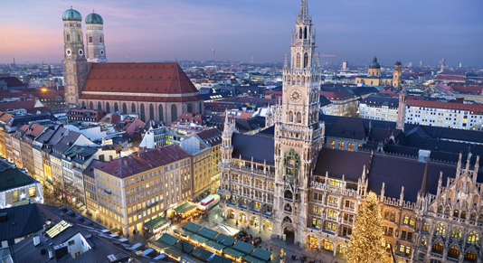 Aerial image of Munich Germany with Christmas Market and Christmas decoration during sunset.